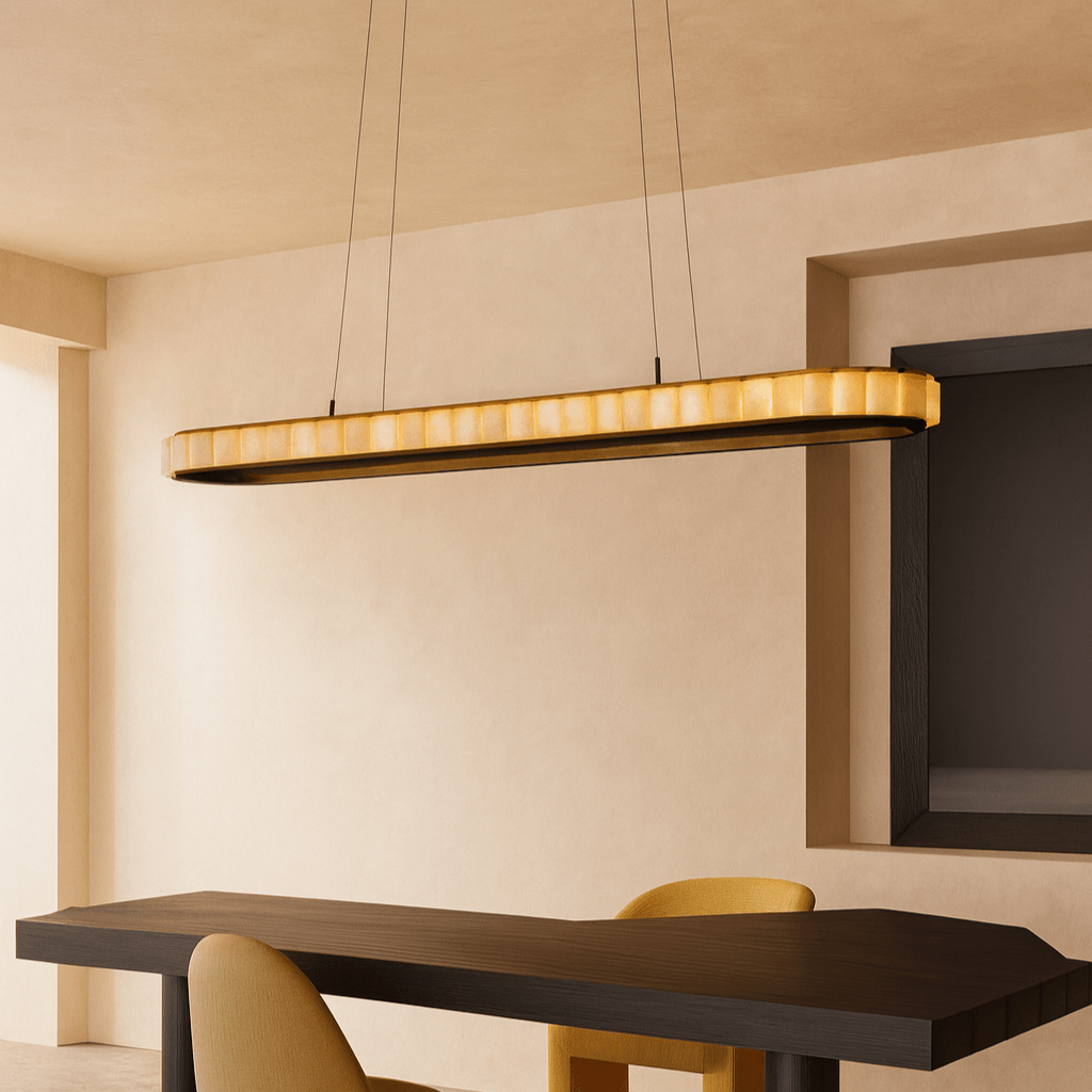 A modern dining room with a dark wood table, yellow chair, and the Morsale Hampton Marble Dining Room Chandelier, an oval-shaped dimmable LED pendant. Beige walls and ceilings offer a minimalist backdrop for this stylish dining room lighting.