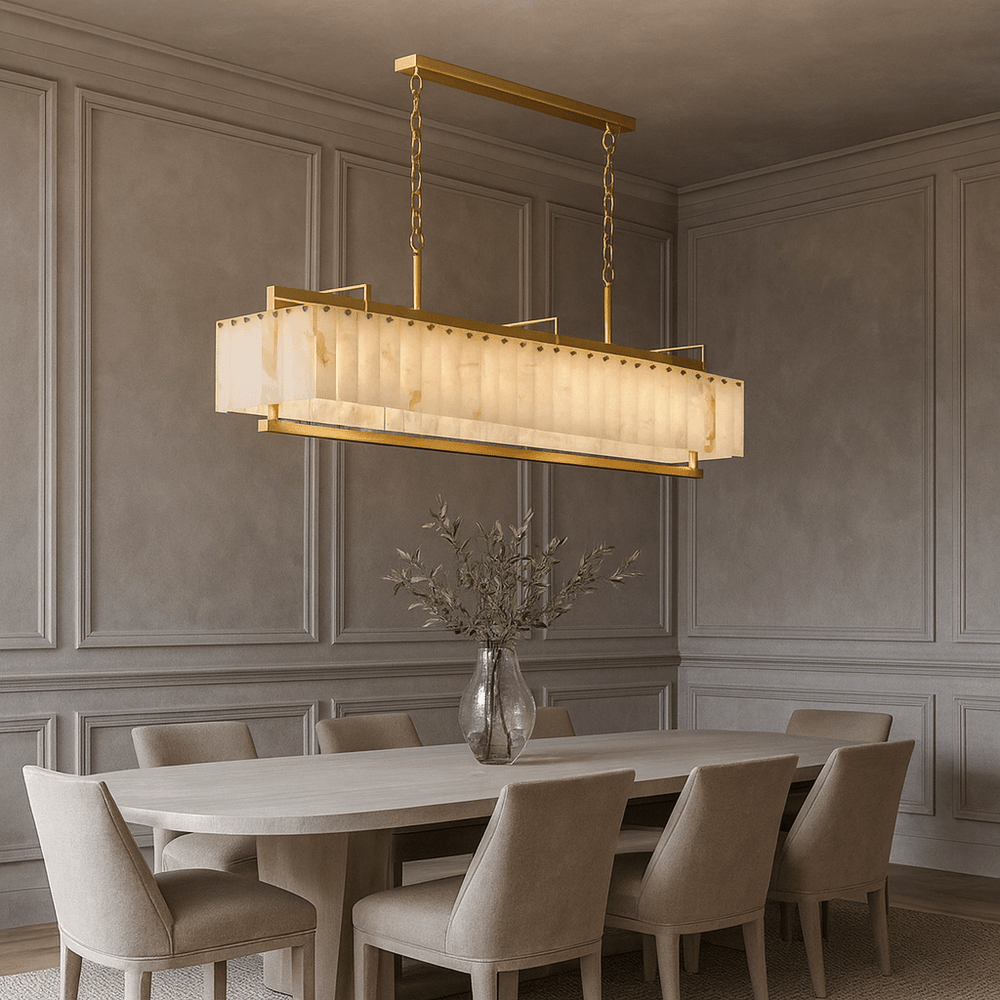
                  
                    A modern dining room features a rectangular table with eight upholstered chairs, a glass vase with green branches, and the striking Morsale Valente Marble & Copper Chandelier above. Elegant wall paneling completes the look.
                  
                
