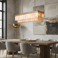 Windsor Linear Marble Dining Chandelier illuminating a modern dining room with elegant decor and subtle lighting.
