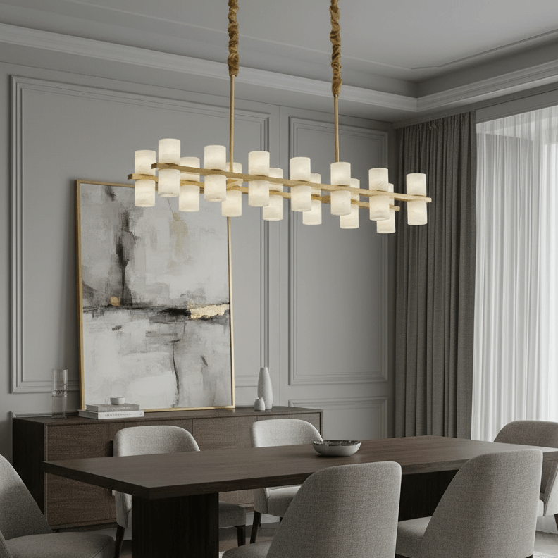 Modern dining room with a long wooden table, gray cushioned chairs, abstract wall art, and the Morsale Lunara Linear Marble Chandelier featuring multiple frosted glass shades. Neutral tones and soft natural light finish the look.
