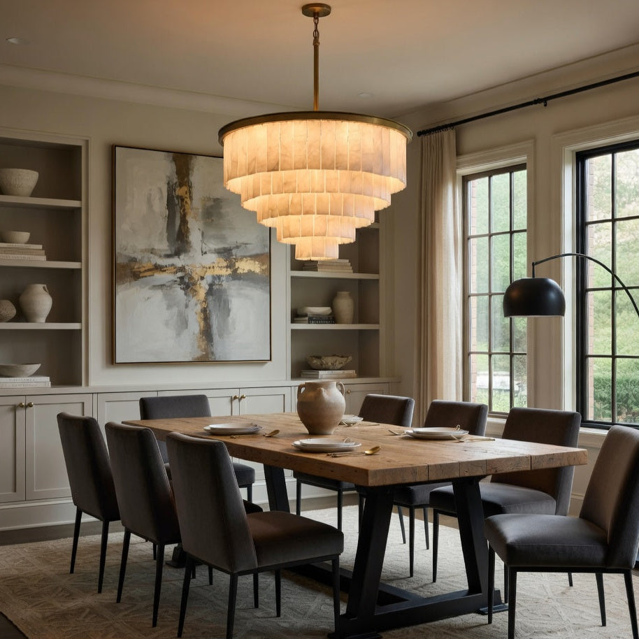 Dining room with wooden table, chairs, and a chandelier.