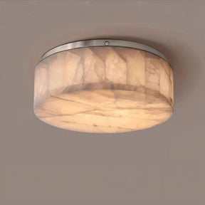 Introducing the Moonshade Natural Marble Ceiling Light Fixture from Morsale.com: a round, flush-mount ceiling light featuring a brushed nickel frame and a frosted, marble-patterned glass shade. The energy-efficient LED lights emit a warm glow, perfect for enhancing the modern minimalist look on any plain, beige ceiling.