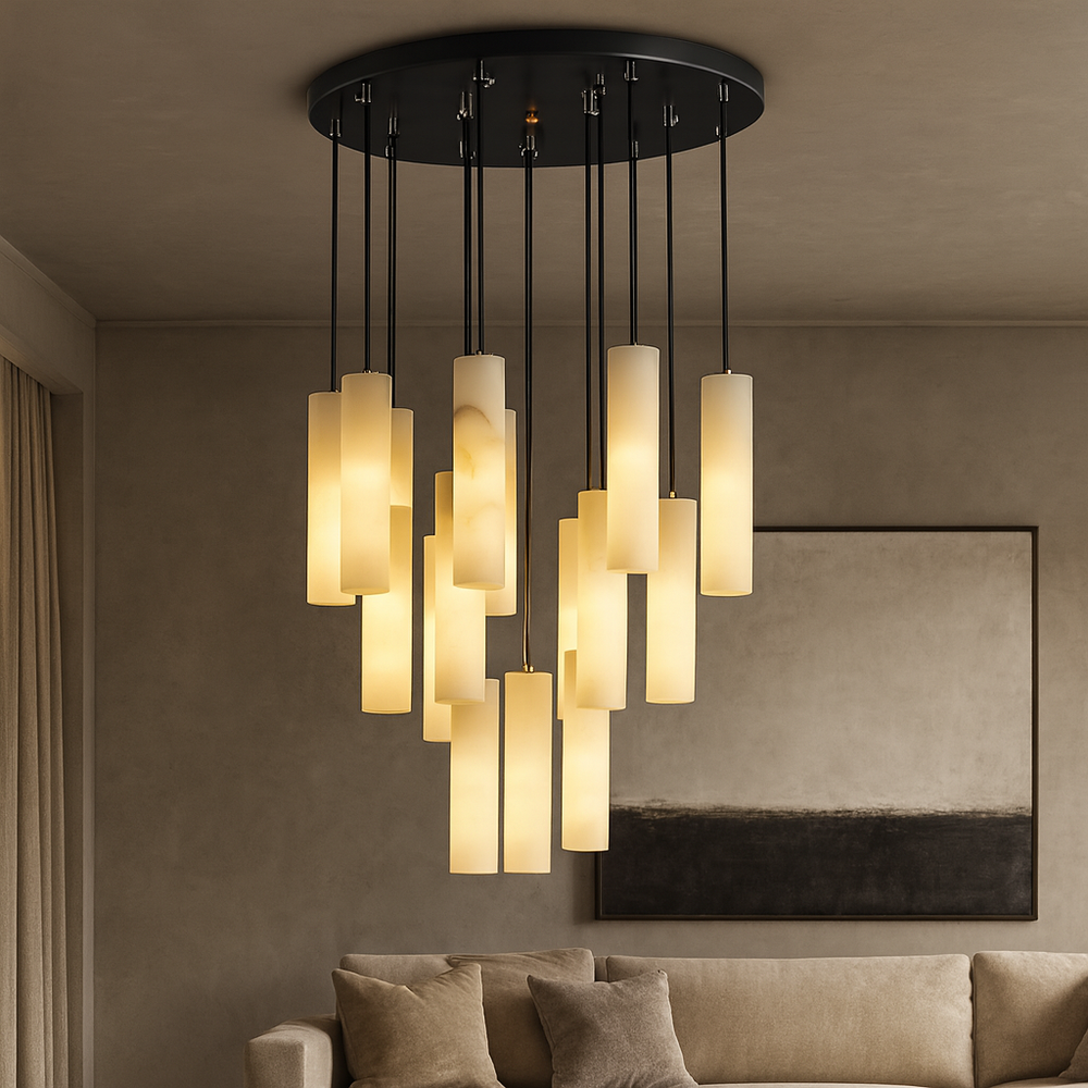 
                  
                    Contemporary living room with the Moonshade Marble Pendant Light Fixture by Morsale.com, featuring multiple hanging frosted glass cylinders, a beige cushioned couch, and abstract neutral wall art in the background.
                  
                