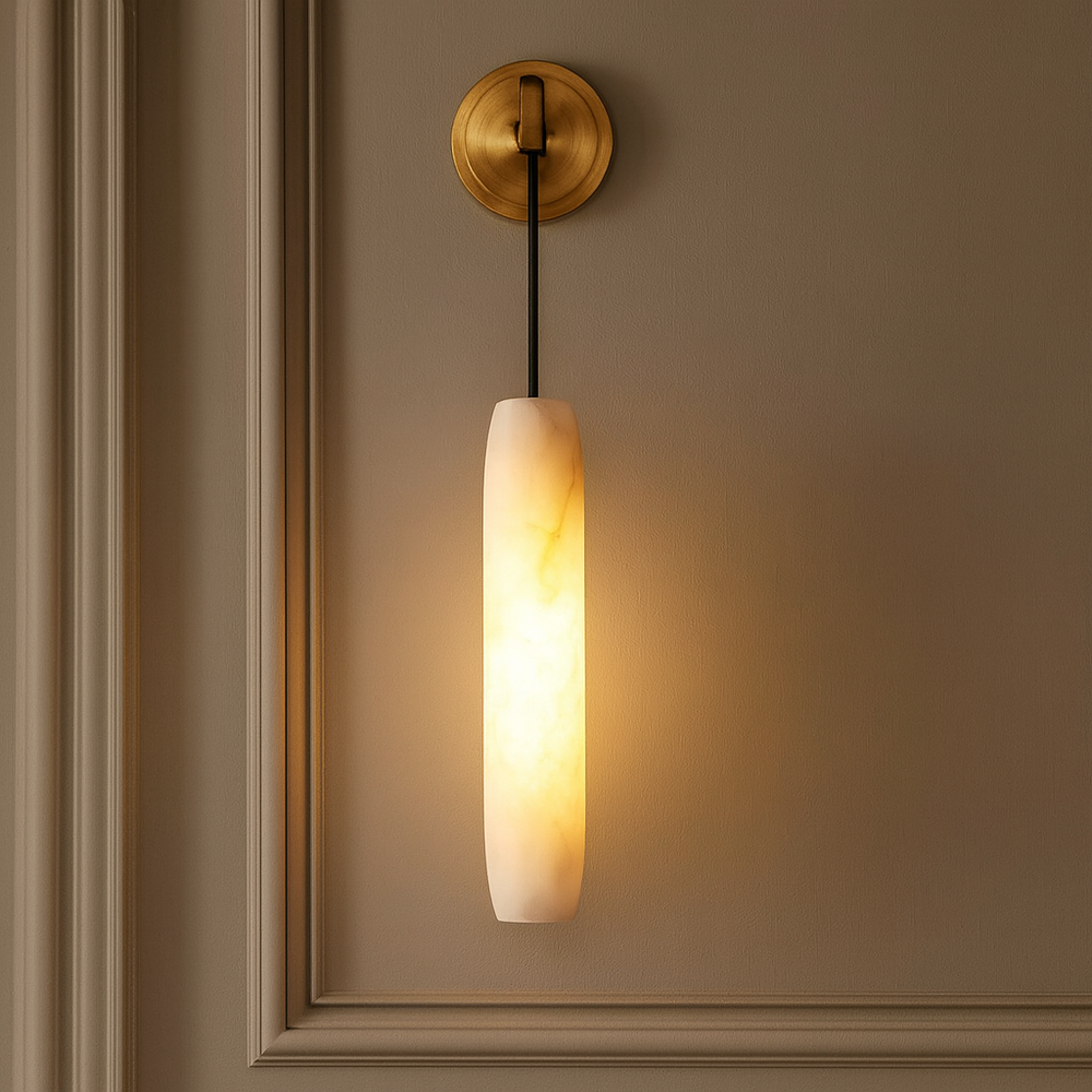 
                  
                    Wall-mounted light fixture with a warm glow on a beige wall.
                  
                