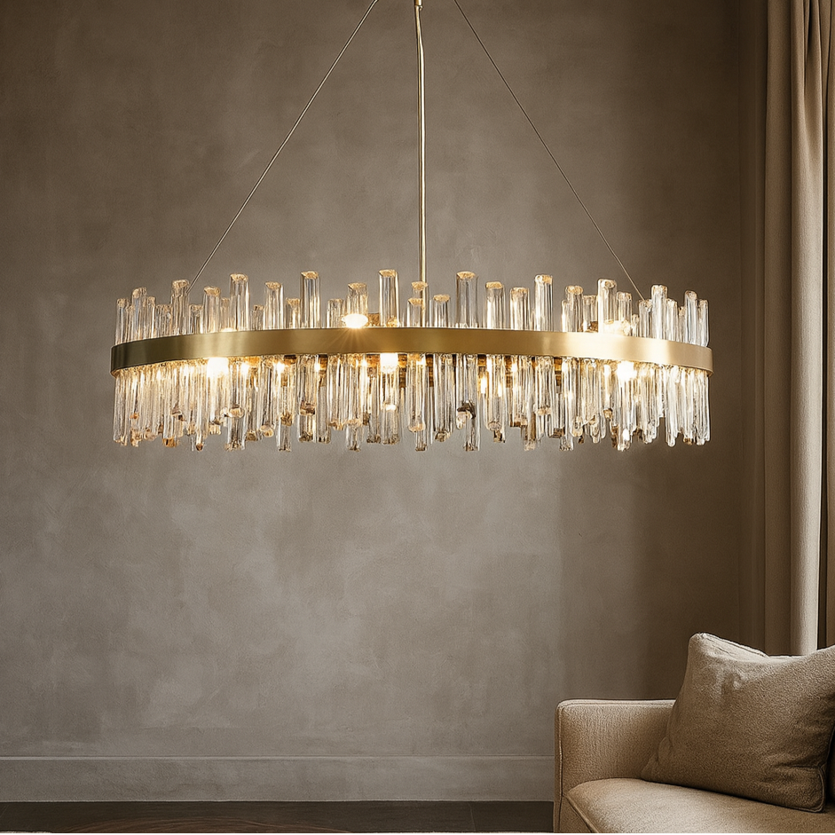 Chandelier hanging above a sofa against a gray wall
