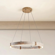 The Morsale Natural Travertine Modern Light Fixture features a textured circular design with LED bulbs, suspended by thin wires from a wooden mount. It emits warm light, enhancing its elegant look against a white ceiling and embodying true contemporary style.