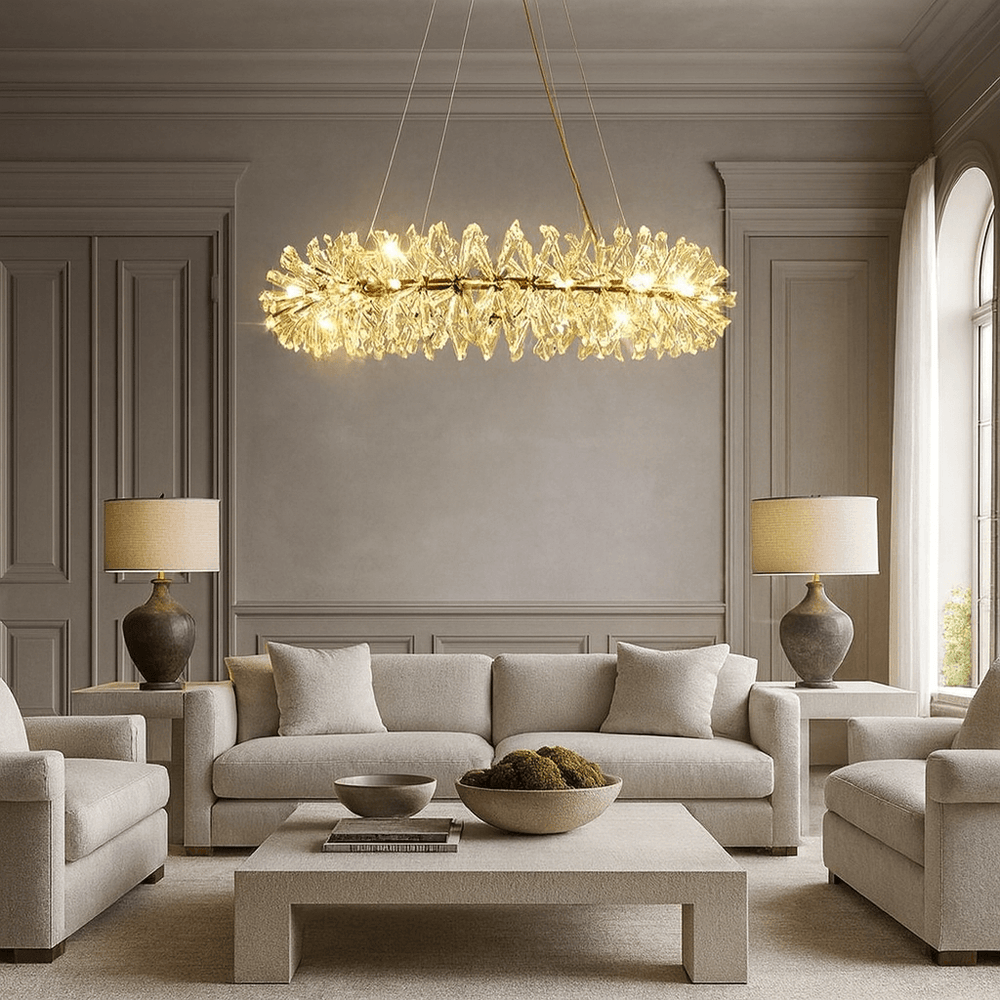 A luxurious living room with neutral sofas, matching armchairs, and a rectangular coffee table is illuminated by the Exton Crystal Chandelier from Morsale.com, its glowing crystal-like elements adding striking modern elegance to the space.