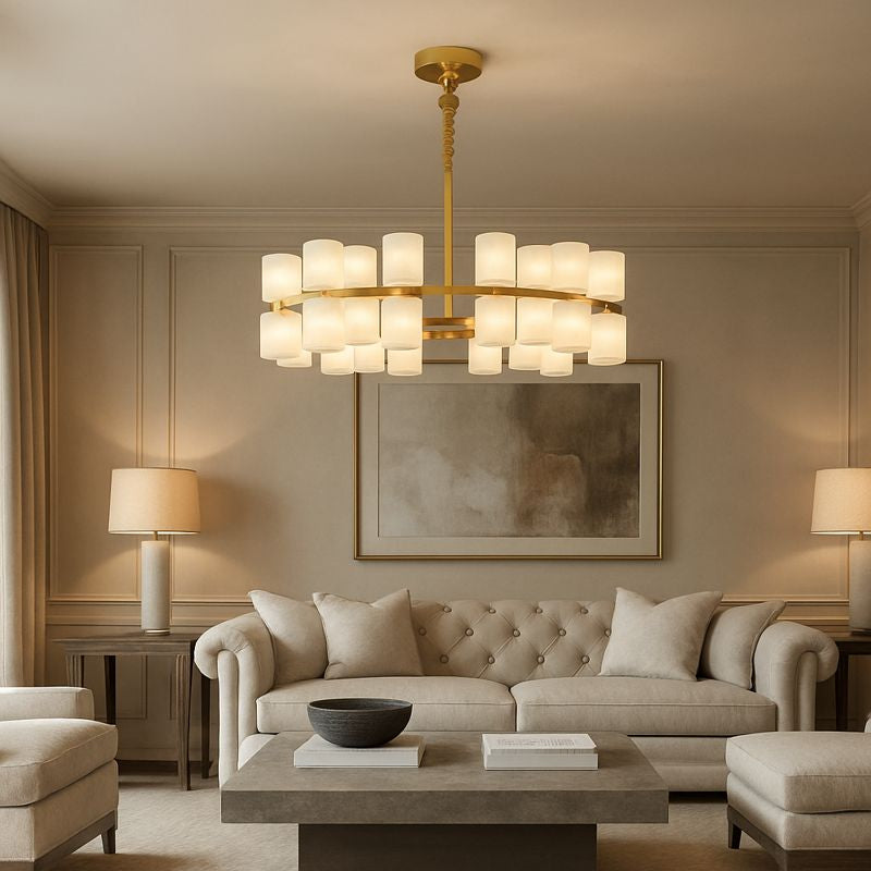 Elegant living room with beige sofas, a tufted loveseat, a modern concrete coffee table, two table lamps, abstract wall art, and the Morsale Lunara Marble Chandelier featuring multiple cylindrical frosted glass shades for statement illumination.