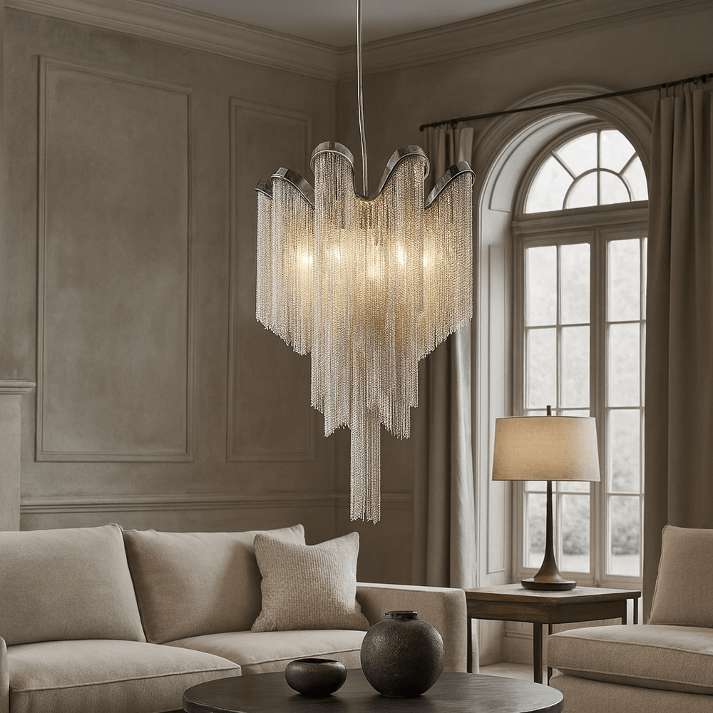 Elegant living room with a beige sofa, round coffee table with vases, a large arched window, and the Cadena French Empire Chandelier by Morsale.com as the ceiling light. A table lamp is placed on the side table.