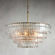 The Morsale Riviera Vintage French Crystal Chandelier, with its brass rod and chain, hangs elegantly from the ceiling. Its clear, rippled glass pieces are tiered beautifully, offering a classic touch against a plain gray background.