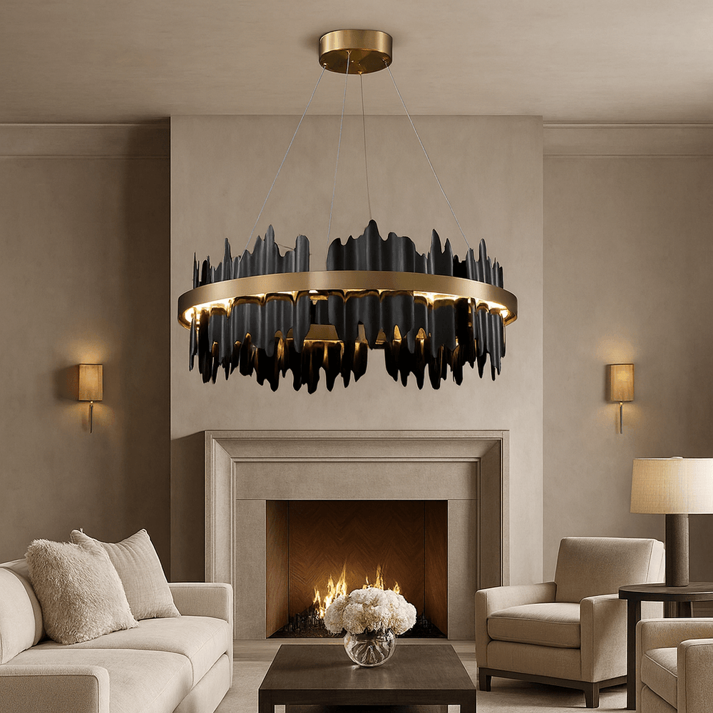 
                  
                    A modern living room with beige walls and furniture, a glowing fireplace, a dark wood coffee table with white flowers, and the Nera Modern Ring Chandelier by Morsale.com—a striking black and gold sculptural piece—hanging overhead.
                  
                