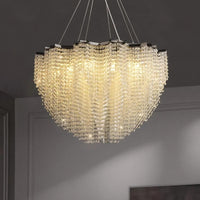 The Alleri Crystal Pendant Chandelier from Morsale.com features cascading crystals that illuminate your modern room with a soft, warm glow, adding a touch of contemporary elegance to any minimalist space.