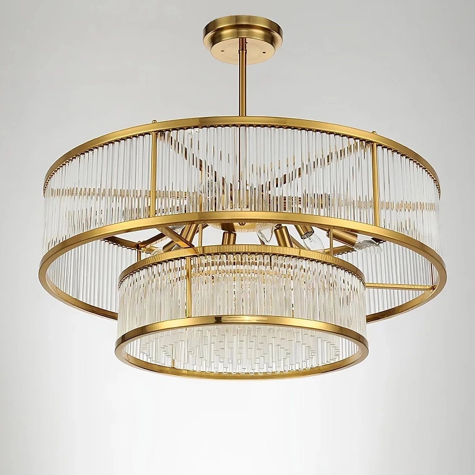 The Gerano Modern Chandelier by Bigman is a contemporary marvel showcasing two concentric circular tiers adorned with vertical crystal rods. Its streamlined gold frame and metallic chain provide an elegant ceiling connection, while the integrated LED bulbs offer a refined and energy-efficient illumination.