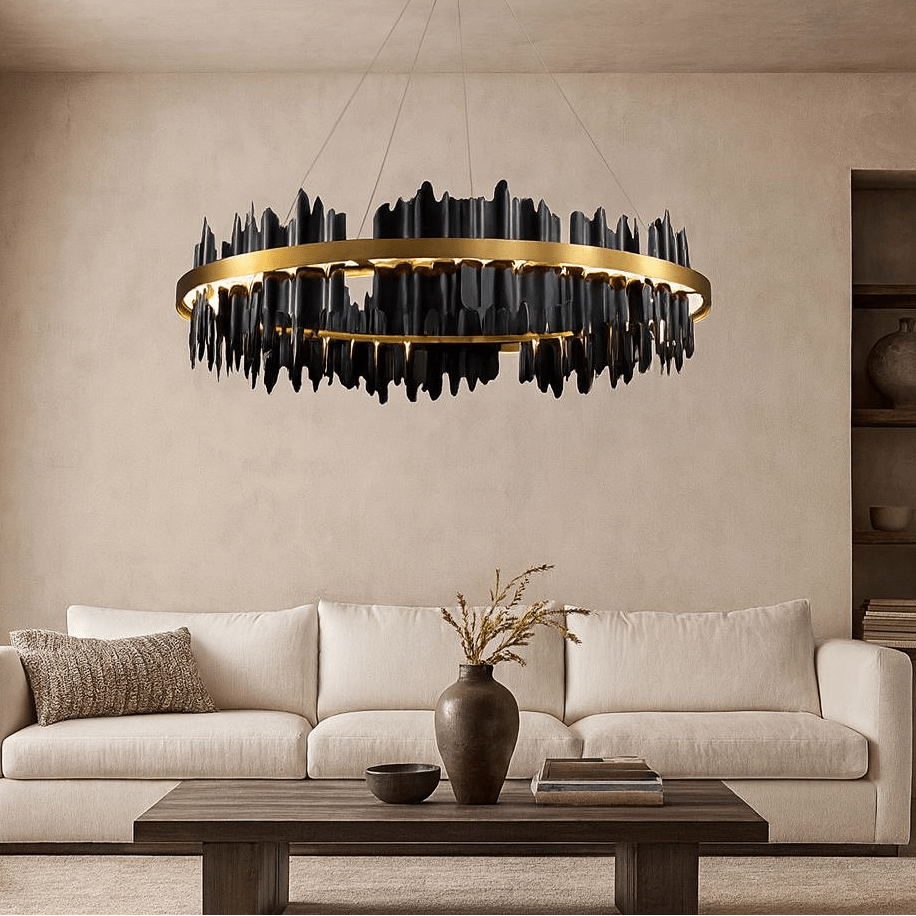 A modern living room with a beige sofa, dark wood coffee table, and the Nera Modern Ring Chandelier by Morsale.com, featuring bold gold and black elements. Neutral decor and shelving create a stylish backdrop for this standout lighting piece.