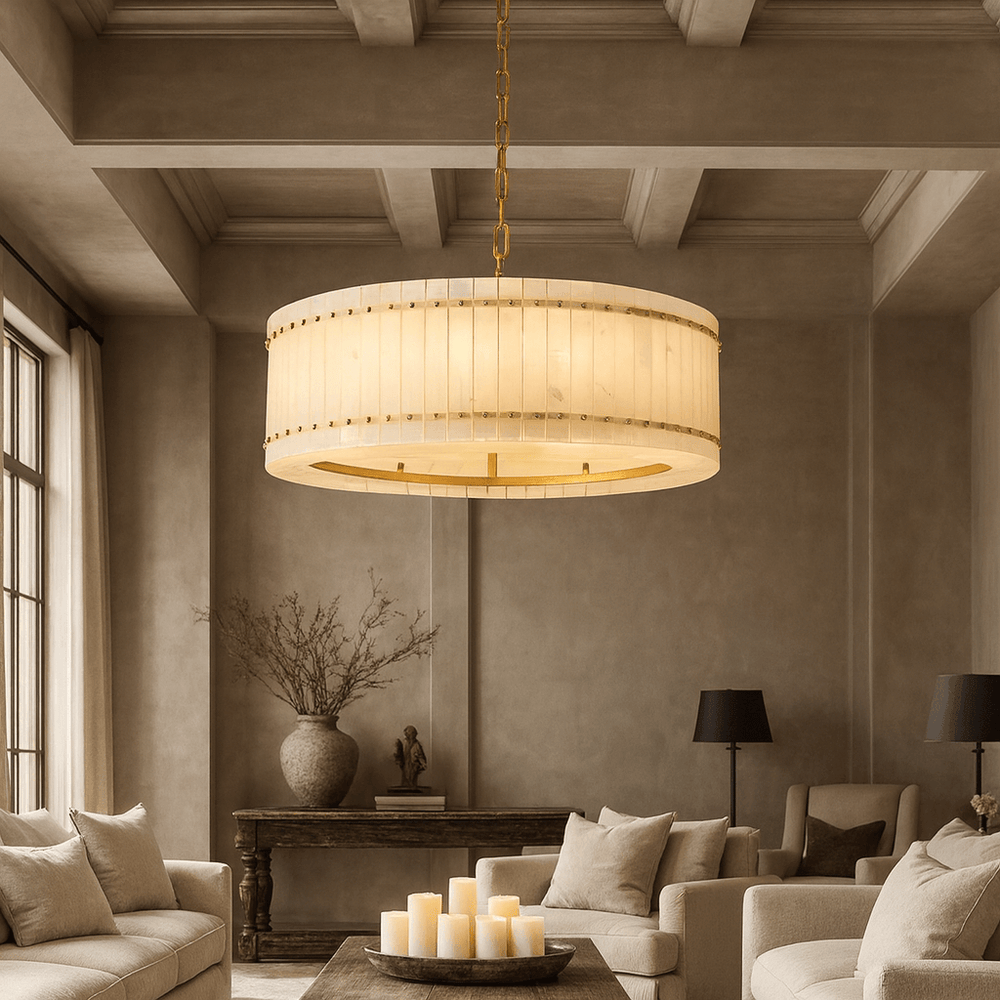 
                  
                    A modern living room with neutral tones showcases the Morsale Valmont Marble Round Chandelier 31", beige sofas, a wooden table with a vase, black lamps, and a tray of pillar candles on the coffee table.
                  
                