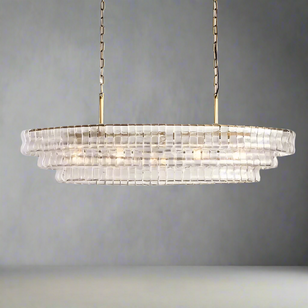 The Riviera Vintage Crystal Dining Room Chandelier by Morsale features a modern design with layered clear panels, suspended from two brass chains. Its warm and glowing light exudes sophistication and contemporary elegance, making it the perfect addition to enhance any dining room setting.