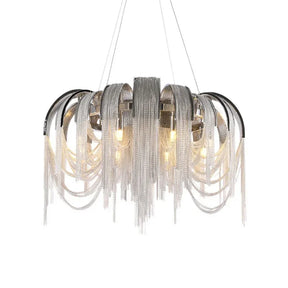 The Cadena Chain Tassel Modern Chandelier by Morsale.com features cascading silver chains inspired by cadena chain tassels and multiple exposed bulbs, creating a sophisticated and elegant lighting fixture. Perfect for home décor, it is suspended by three wires and boasts a metallic finish that enhances its contemporary design.