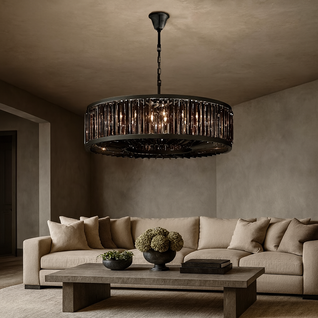 Modern living room with a beige sofa, neutral cushions, a wooden coffee table topped with two decorative bowls, and the striking Gio Crystal Modern Chandelier by Morsale.com featuring vertical glass accents hanging from the ceiling.