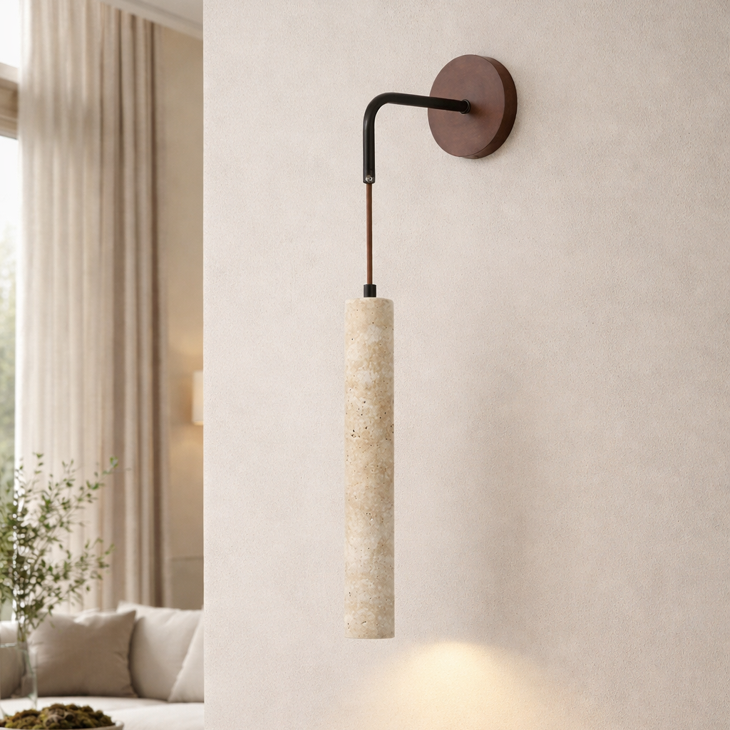 The Morsale Terra Travertine Sconce features a cylindrical natural stone shade hanging from a curved black metal arm on a round brown plate, perfect for softly lit, neutral-toned living rooms.
