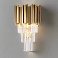 The Gio Crystal Wall Sconce by Morsale.com features gold electroplated stainless steel and clear handmade crystals in a tiered geometric design, bringing soft illumination to any neutral wall.