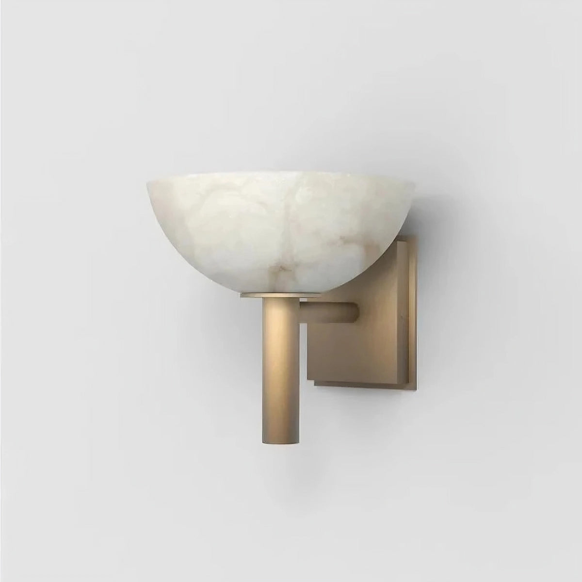 The Morsale Spanish Marble & Copper Antique Sconce features a wall-mounted light fixture with a round, white, frosted glass shade and a sleek, gold-finished metal base, set against a plain white background to create a luxurious atmosphere.