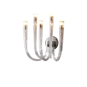 A contemporary lighting fixture, the Candela Glass Wall Sconce by Morsale.com features six upward-facing curved arms attached to a central circular base. Each arm is topped with a cylindrical light, emitting a warm glow. With its sleek, metallic finish and minimalist design, it serves as an elegant addition to any space.