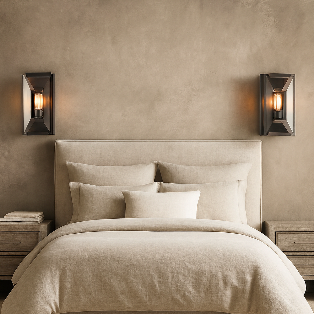 
                  
                    A modern bedroom features a beige upholstered bed, cream bedding, wooden nightstands, and two Brookhill Crystal Wall Sconces by Morsale.com with warm luxury lighting and sleek iron frames above each nightstand.
                  
                