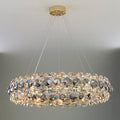 Monte crystal wheel chandelier by Morsale.com, a 31-inch wheel of smoke grey and clear K9 crystal on a polished steel frame above a dining table.