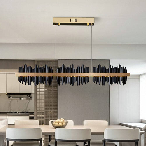 Rivaro Modern Linear Chandelier illuminating a contemporary kitchen with a sleek design and elegant silhouette.